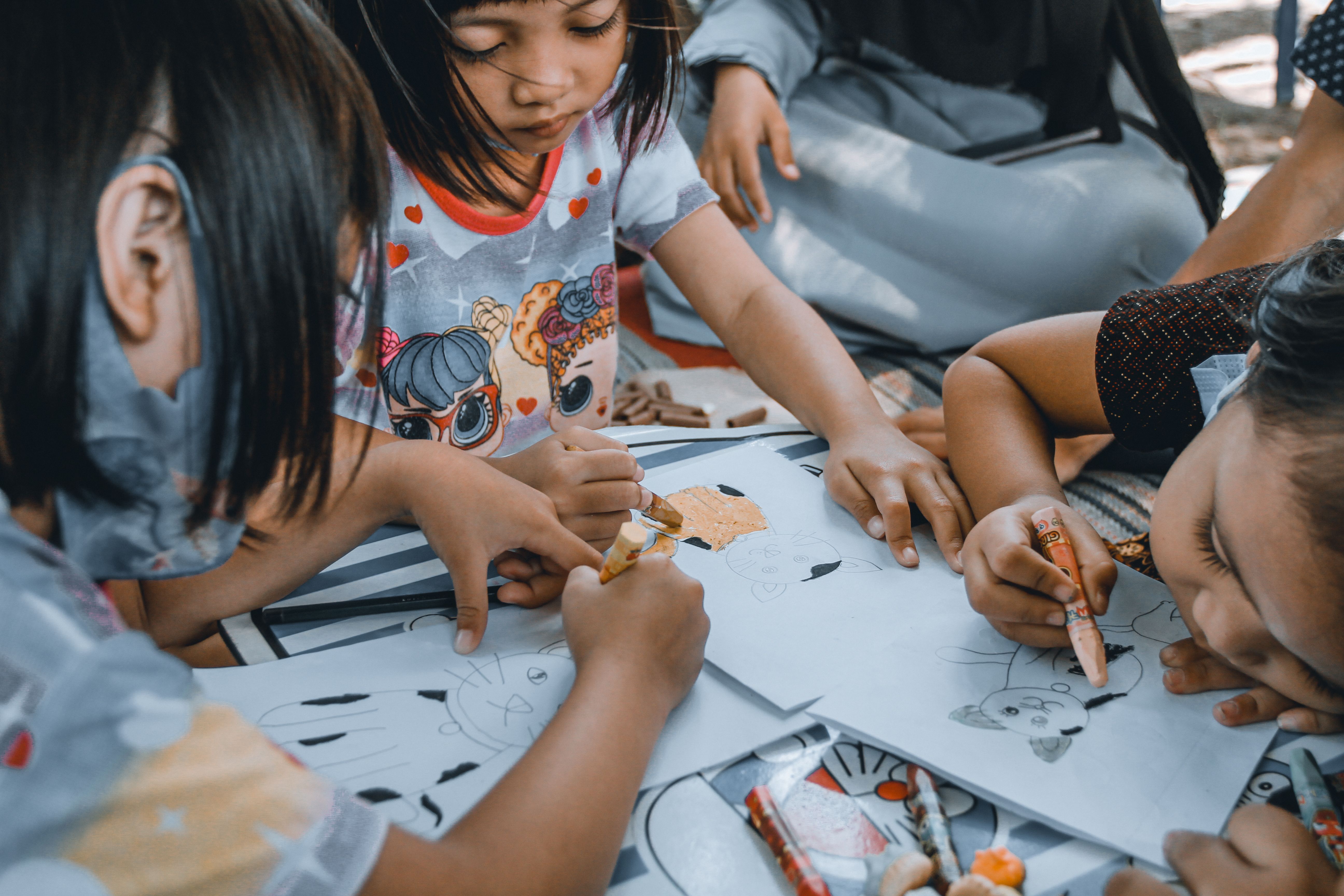 Childcare teachers with young children in a daycare center