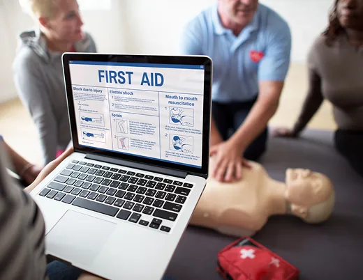 Online First Aid, CPR and AED certification course on a laptop