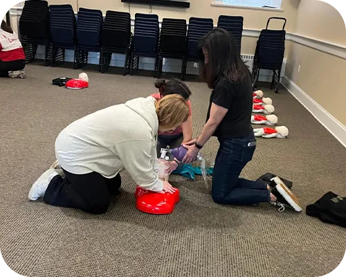 Participants practicing Basic Life Support skills during an instructor-led class